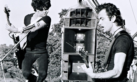 The Stranglers’ Jean-Jacques Burnel and Hugh Cornwell playing in Battersea Park in London in 1978